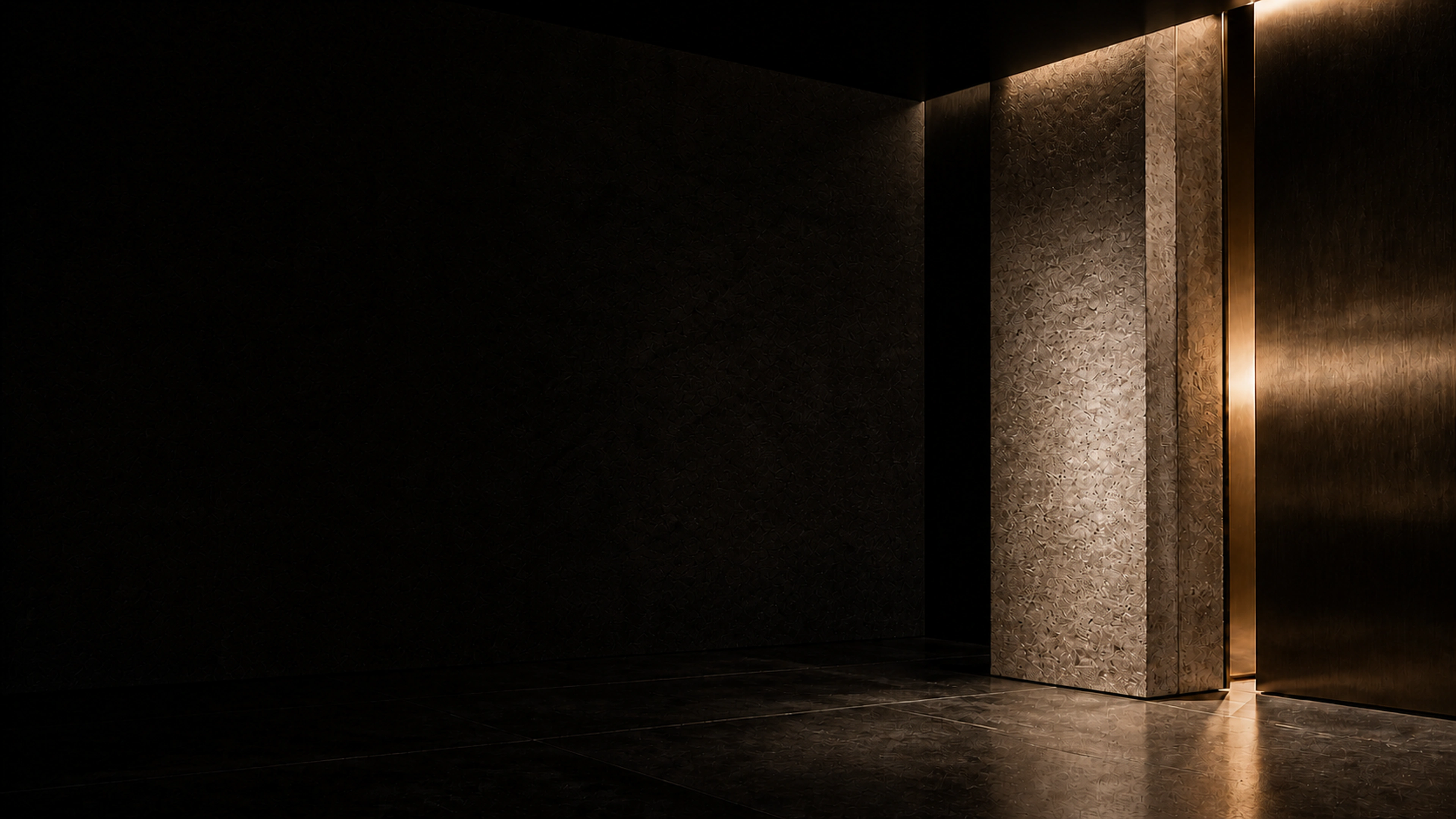 Sculptural onyx and travertine architecture illuminated by warm, restrained light
